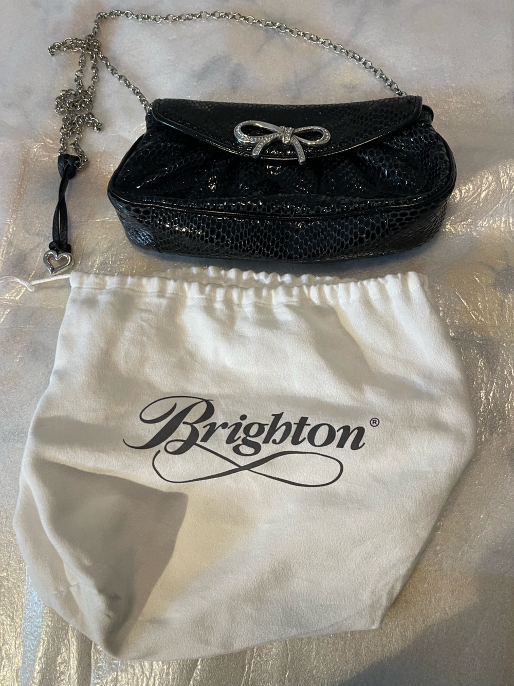 Brighton Black Embossed Leather Clutch with Silver Bow Detail